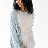 Female modeling the Bamboo Jersey Adult Cardigan in Fog paired with Oat shirt and pants