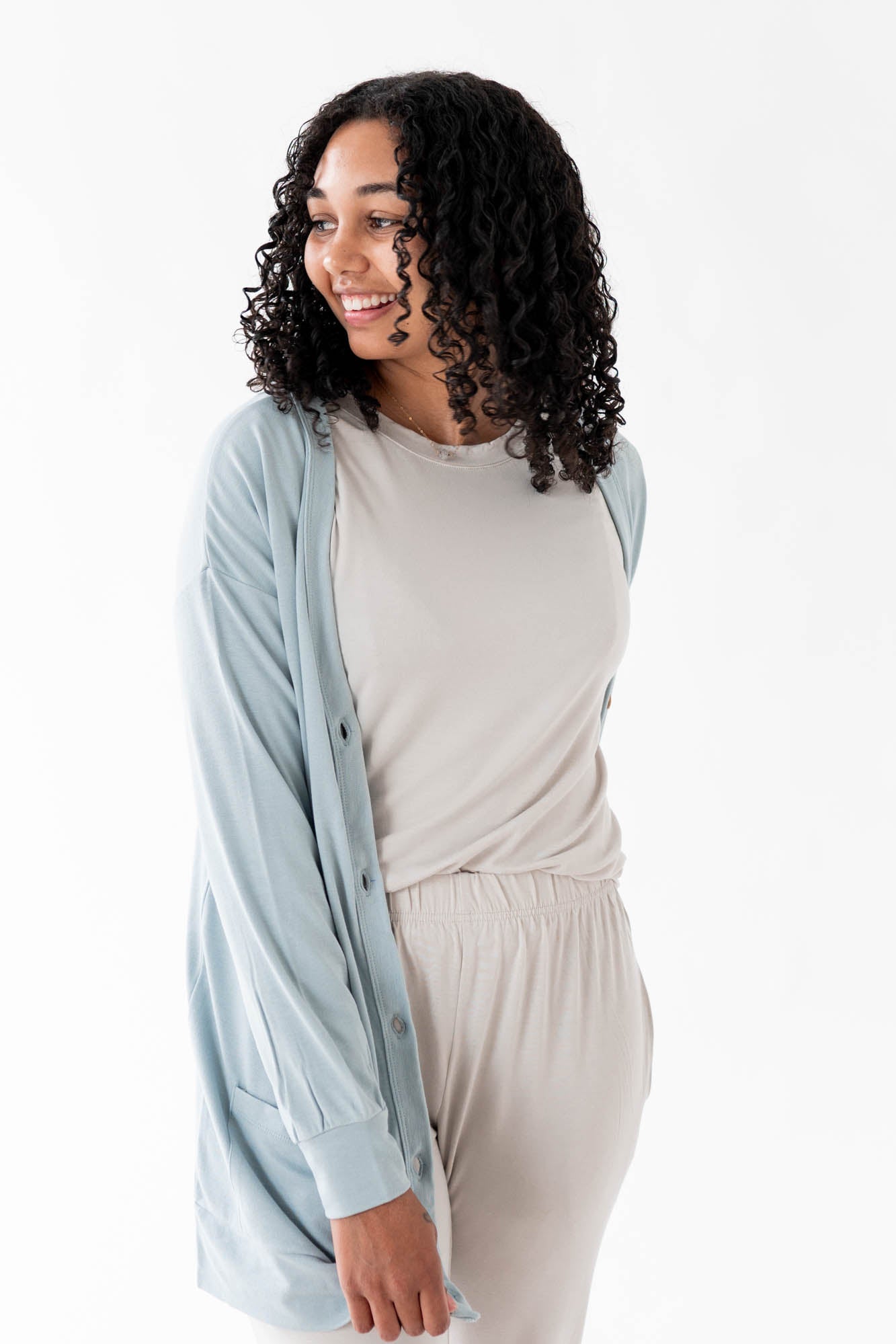 Female modeling the Bamboo Jersey Adult Cardigan in Fog paired with Oat shirt and pants