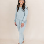Smiling woman modeling the Kyte Woman's Jogger Set in Fog