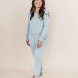Smiling woman modeling the Kyte Woman's Jogger Set in Fog