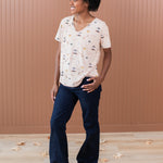 Woman modeling the Women's Relaxed Fit V-Neck in Gilmore Girls paired with dark jeans