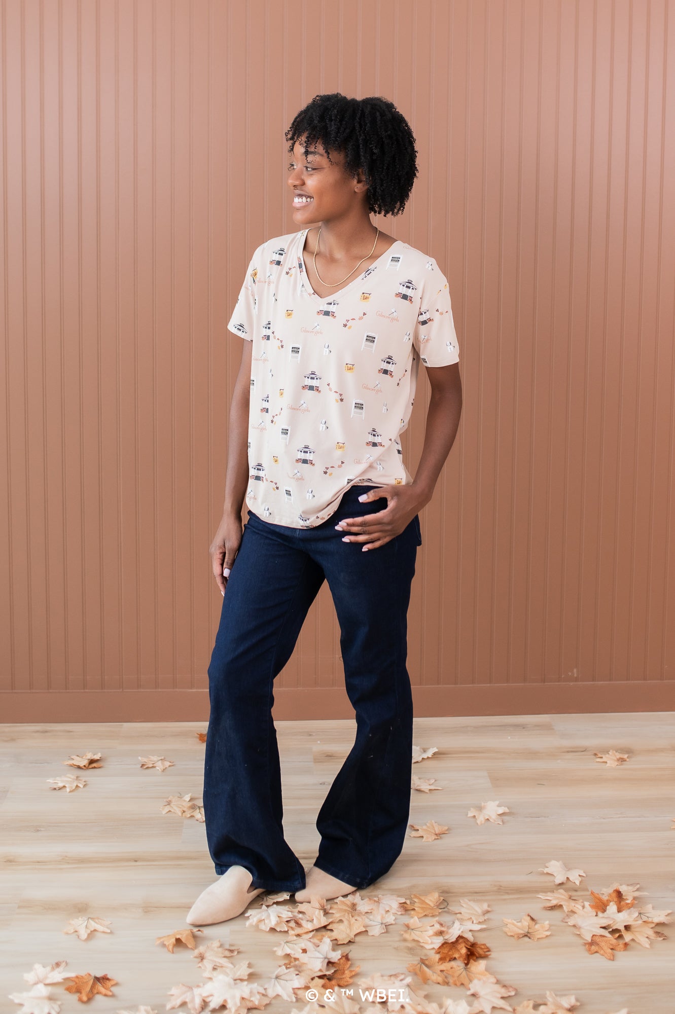 Woman modeling the Women's Relaxed Fit V-Neck in Gilmore Girls paired with dark jeans