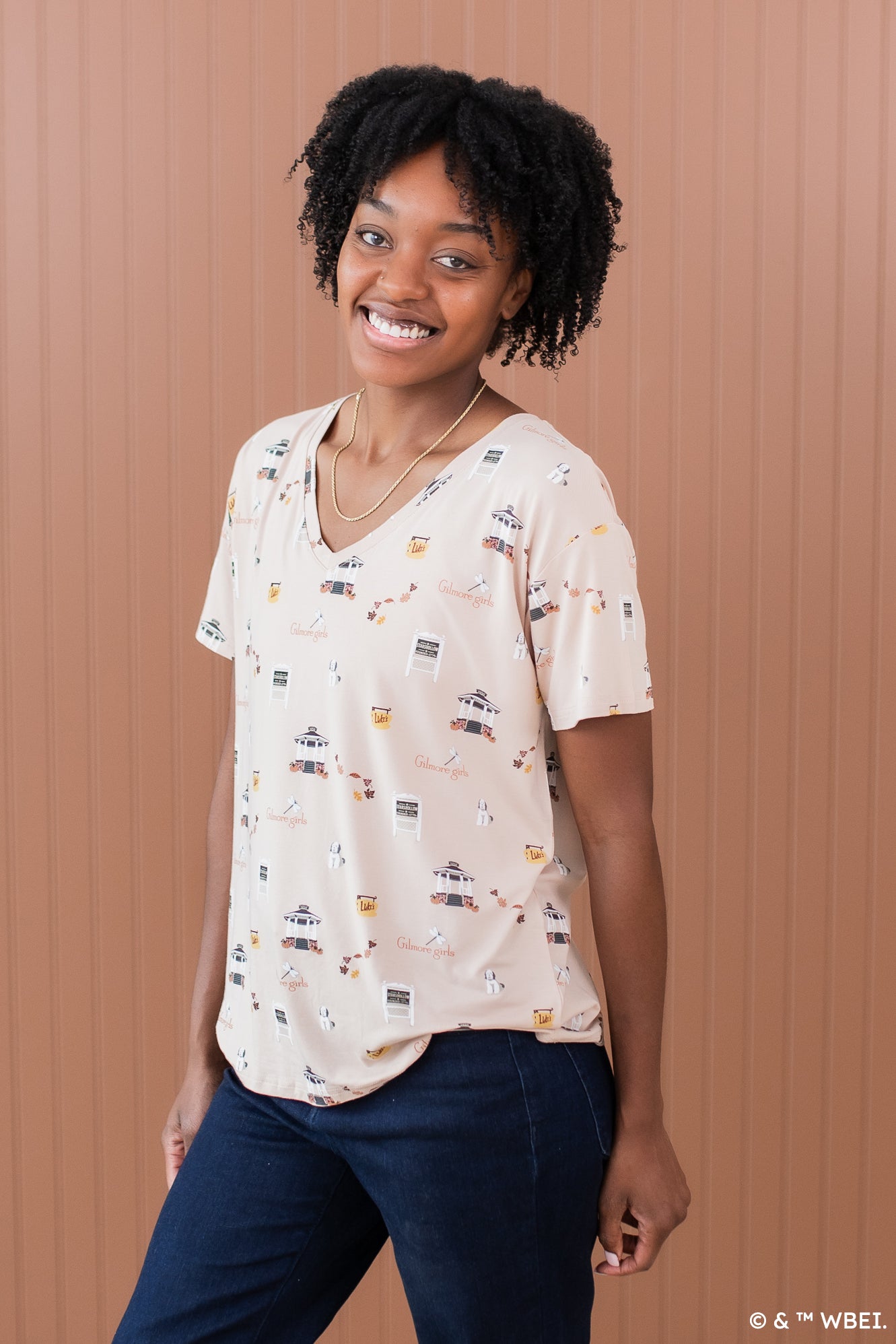 Smiling model wearing the Women's V Neck in Gilmore Girls
