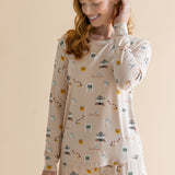 Close up of the top from the Women's Jogger Pajama Set in Gilmore Girls on model who is smiling downwards with one hand in her hair 