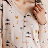 Close up of the Women's Long Sleeve Henley Tee in Gilmore Girls showcasing the buttons and print on a model 