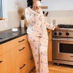 Woman drinking from a mug in a kitchen while wearing the Long-Sleeved Women's Pajama Set in Gilmore Girls
::: Model is 5'8" wearing size M ///