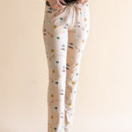 Close up of the Women's Lounge Pants in Gilmore Girls paired with a cami with hands on waistband 