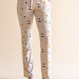 Close up of the Women's Lounge Pants in Gilmore Girls on a model standing in front of a beige background