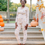 Model standing on gazebo stairs wearing the Women's Jogger Pajama Set in Gilmore Girls