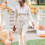 Model walking while smiling and looking to the side while wearing the Women's Jogger Pajama Set in Gilmore Girls