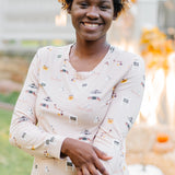 Smiling model with her hand on her arm wearing the Women's Jogger Pajama Set in Gilmore