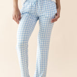 Person wearing blue and white checkered pajama pants on a beige background ::: Model is 5'11" wearing size S ///