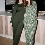  Models standing next to a counter while wearing the Women's Long Sleeve Pajama Set in Gingham Fir and Jogger Set in Fir