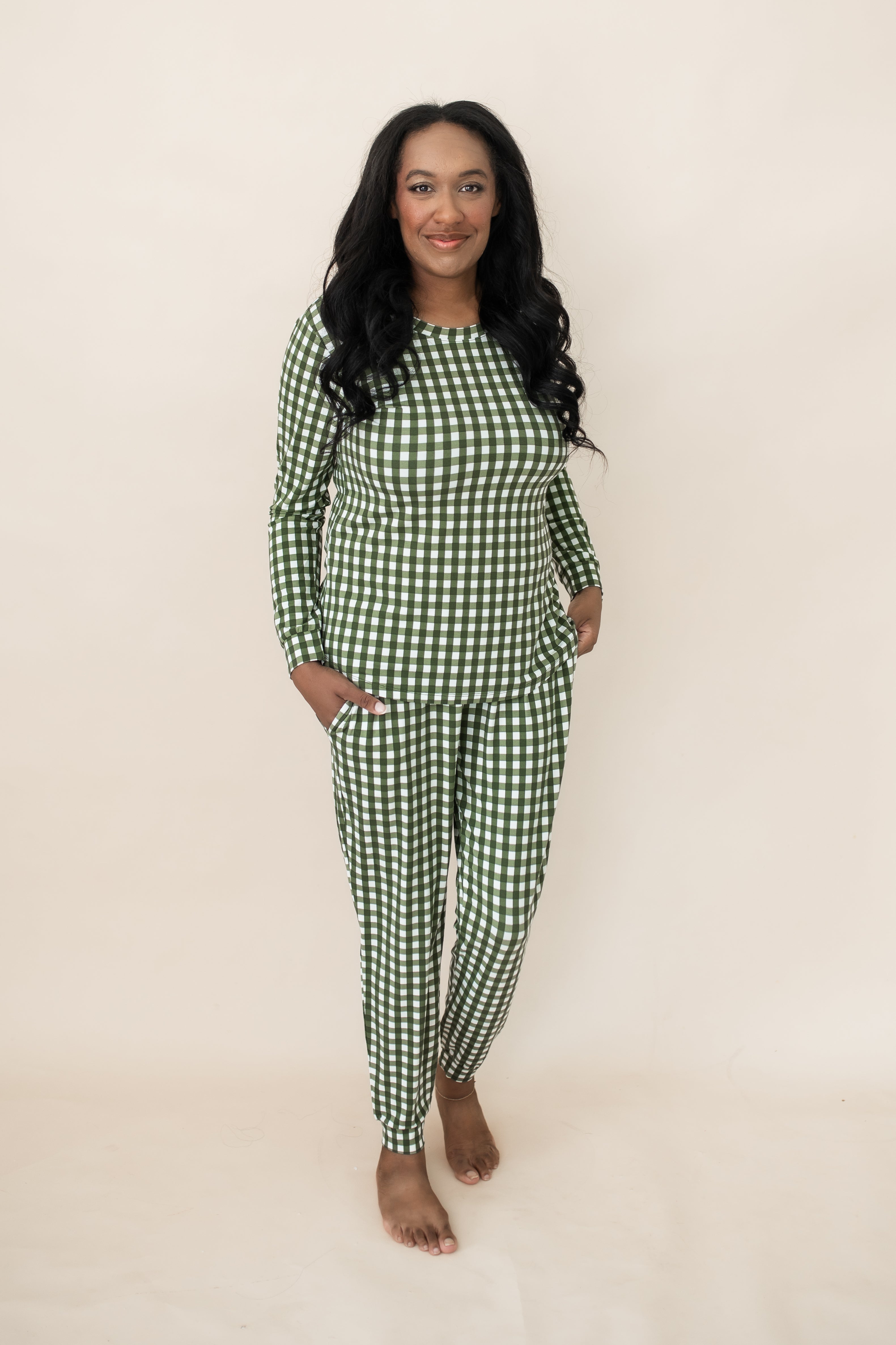 Woman smiling while modeling the Kyte Bamboo Women's Jogger Pajama Set in Gingham Fir