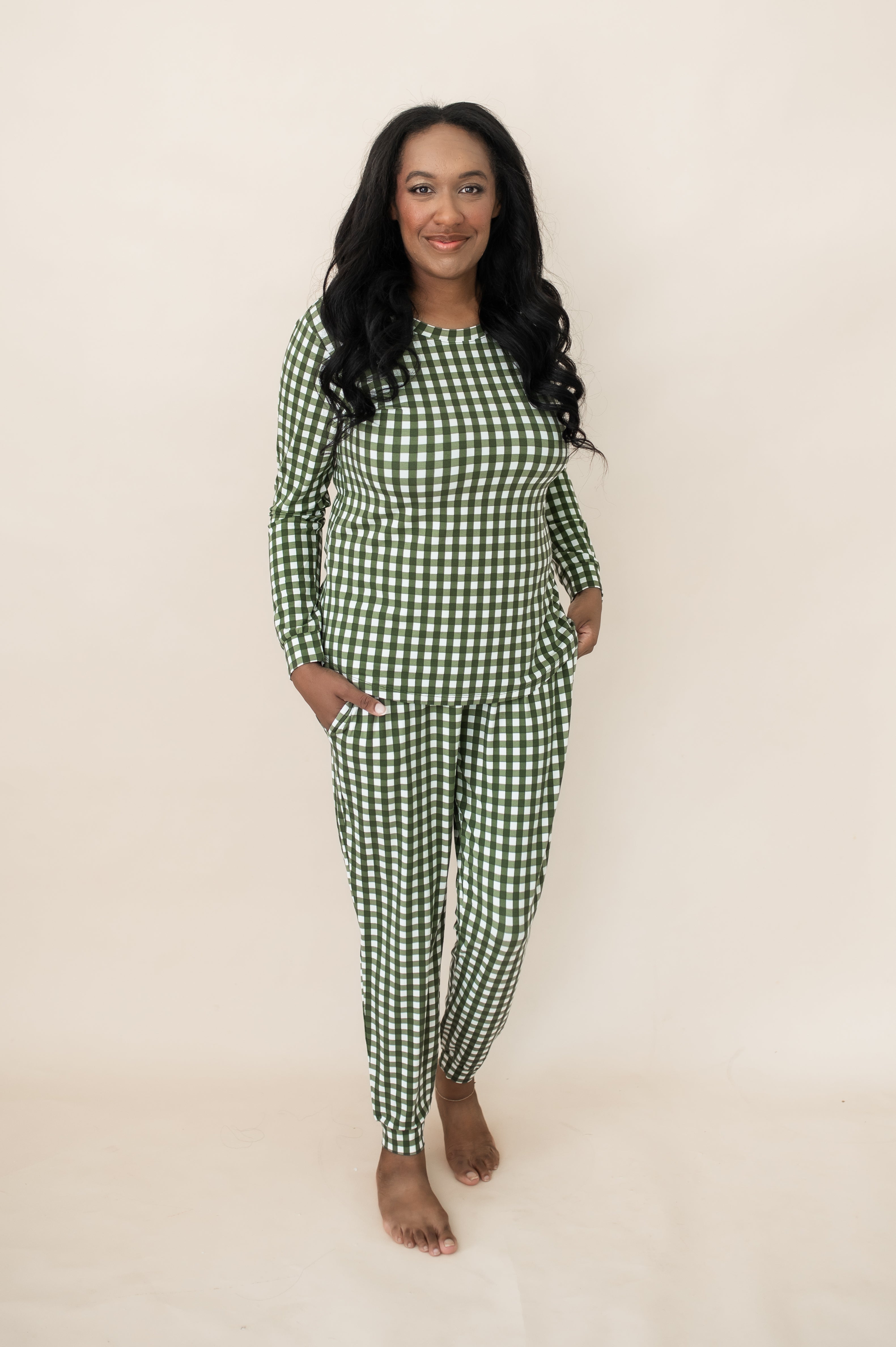 Woman smiling while modeling the Kyte Bamboo Women's Jogger Pajama Set in Gingham Fir