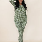 Model with hand in hair while wearing the Bamboo Women's Jogger Pajama Set in Gingham Fir