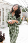 Woman wearing a green and white checkered outfit standing outdoors holding coffee cup  ::: Model is 5'2" wearing size S ///