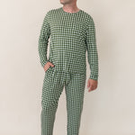 Model looking to the side with one hand in pocket while wearing the Bamboo Men's Jogger Set in Gingham Fir