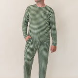 Model looking to the side with one hand in pocket while wearing the Bamboo Men's Jogger Set in Gingham Fir