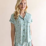 Model posing in Women's Short Sleeve Pajama Set in Golf print on beige background ::: Model is 5'9" wearing size XS ///

