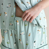 Model showcasing the shorts of  Women's Short Sleeve Pajama Set in Golf print on beige background