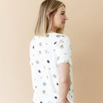The back of the Women's Relaxed Fit V-Neck in Grogu™ on a female model