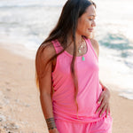 Female model wearing the Women’s Tank Set in Guava