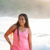 Smiling model wearing the Women’s Tank Set in Guava