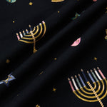 Close up of Black fabric with Hanukkah Nights print 