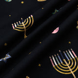 Close up of Black fabric with Hanukkah Nights print 