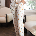 Modal show casing the pajama pockets of Beige Long-Sleeved Women's Pajama Set in Halloween Teddy print ---1605 3