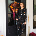 Model posing in Men's Long Sleeve Pajama Set in Halloween Friends print standing in doorway  ::: Model is 6'2" wearing size L ///