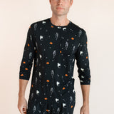 Modal wearing Men's Jogger Set in Halloween Friends print on beige background