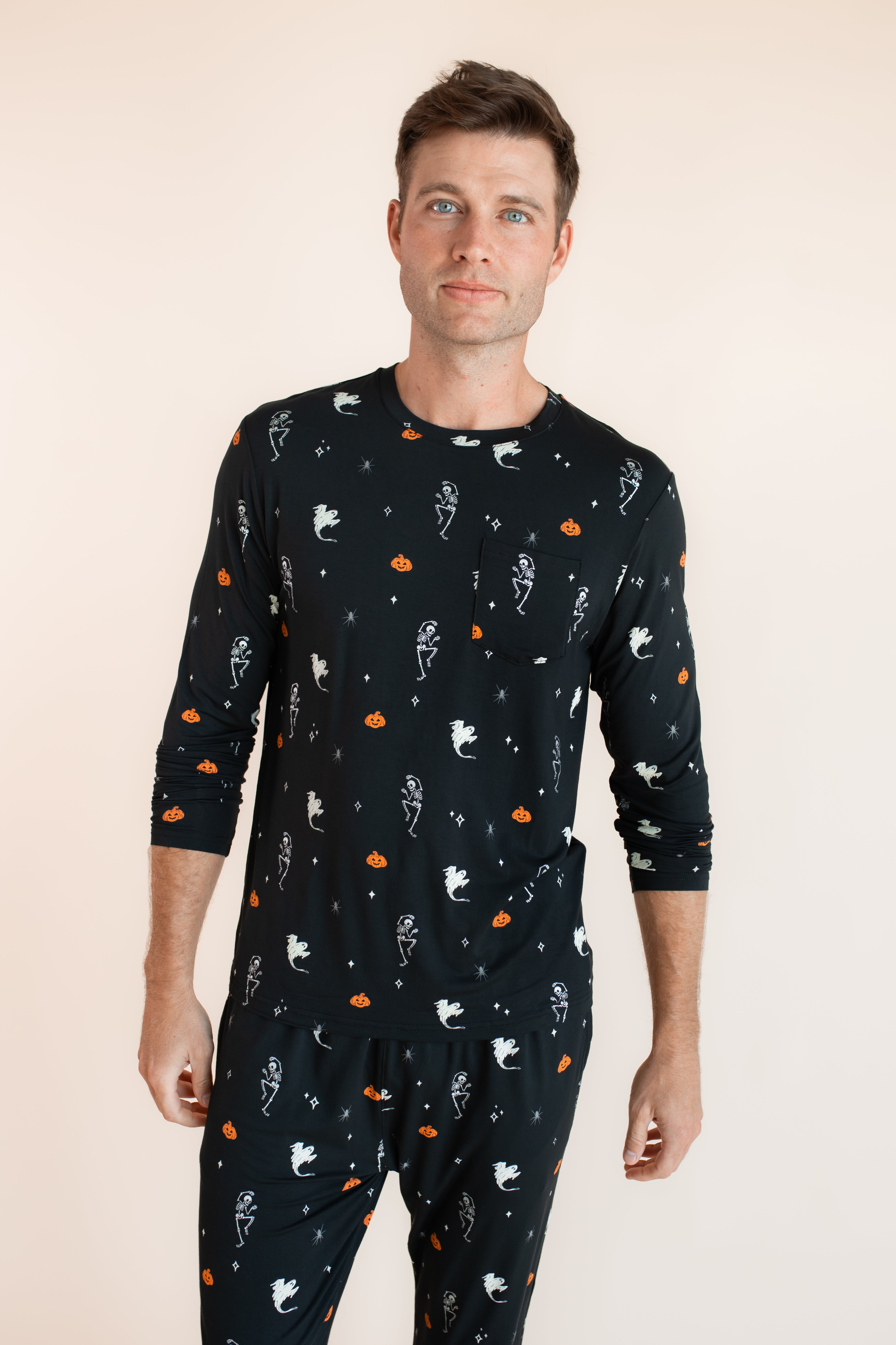 Modal wearing Men's Jogger Set in Halloween Friends print on beige background