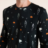 Close up of Modal wearing Men's Jogger Set in Halloween Friends print on beige background