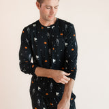 Modal posing in Men's Jogger Set in Halloween Friends print on beige background