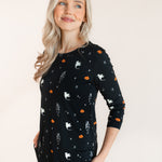 Side pose of Modal wearing Women's Jogger Pajama Set in Halloween Friends print on a beige background