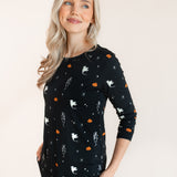 Side pose of Modal wearing Women's Jogger Pajama Set in Halloween Friends print on a beige background