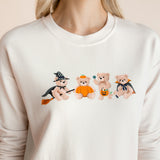 Close up of Modal wearing off white Women's Sweatshirt with Halloween Teddy print in the center