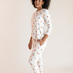 Modal posing with hand in pocket wearing Women's Jogger Pajama Set in Halloween Teddy print on a beige  ::: Model is 5'9"" wearing size S ///background