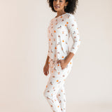 Modal posing with hand in pocket wearing Women's Jogger Pajama Set in Halloween Teddy print on a beige  ::: Model is 5'9"" wearing size S ///background