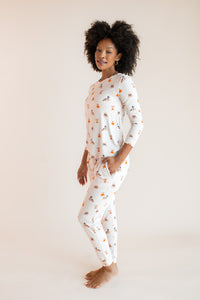 Modal posing with hand in pocket wearing Women's Jogger Pajama Set in Halloween Teddy print on a beige