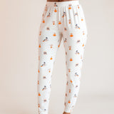 Modal showcasing jogger pajama of Women's Jogger Pajama Set in Halloween Teddy print on a beige background