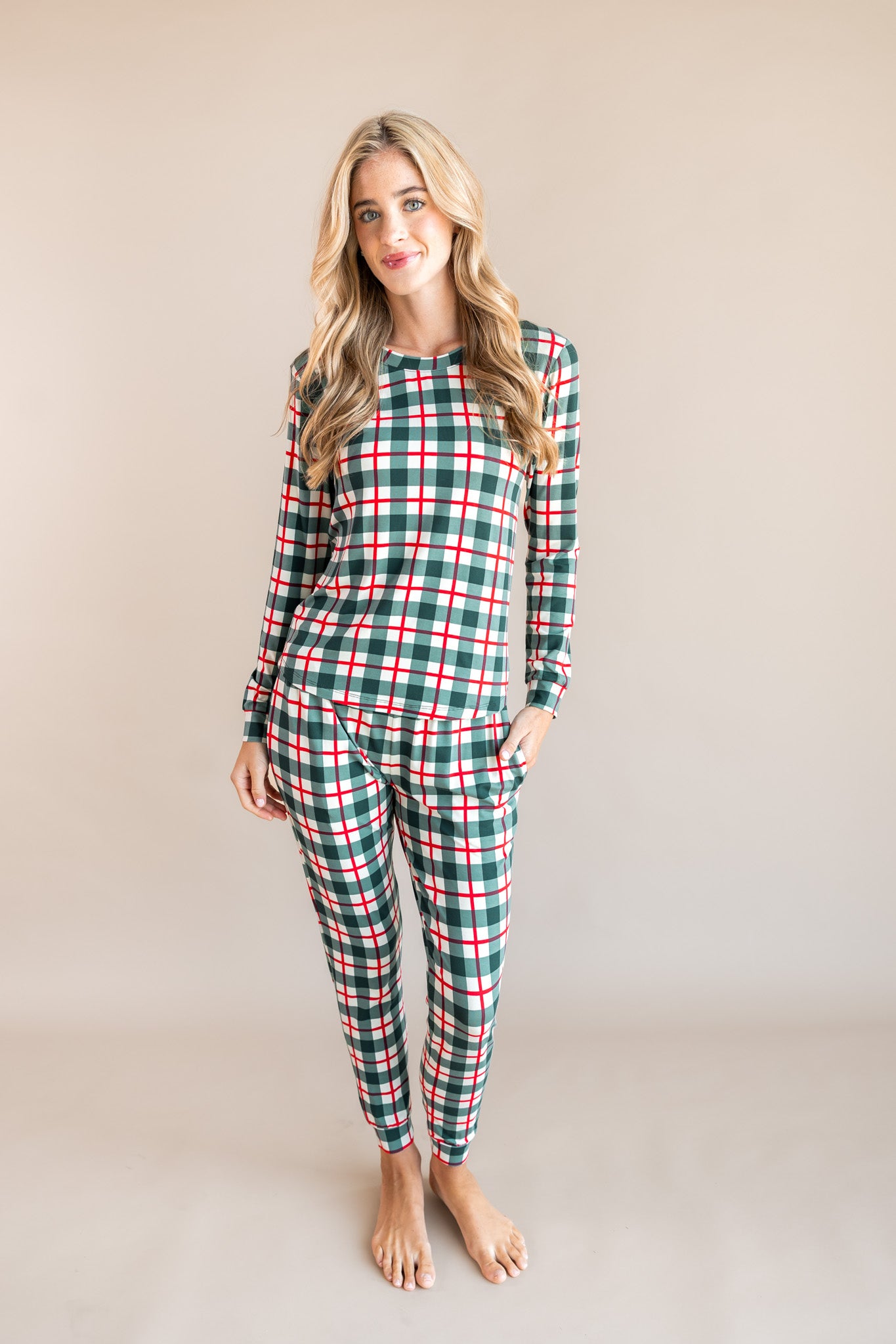 Woman soft smiling in holiday plaid jogger pajamas.
::: Model is 5'10" wearing size S ///