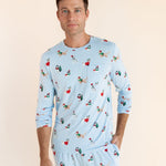 Man posing in Men's Jogger Set in Holiday Pups print on a beige background