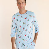 Man posing in Men's Jogger Set in Holiday Pups print on a beige background