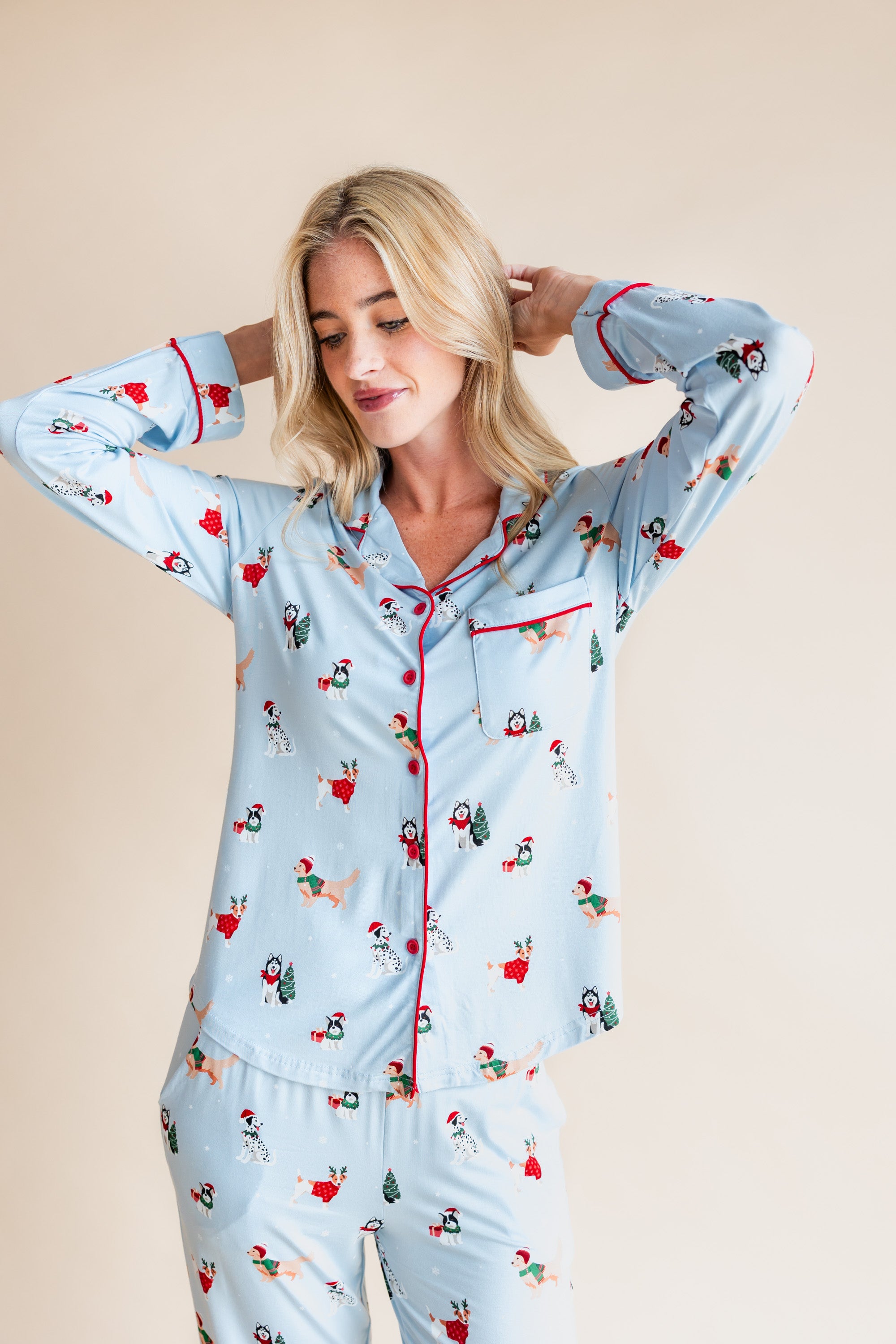 Woman wearing Long-Sleeved Women's Pajama Set in Holiday Pups print on a beige background
---PJ 4