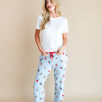Woman wearing Women's Lounge Pants in Holiday Pups print under white T-shirt on a beige background
::: Model is 5'10" wearing size S ///