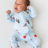Baby wearing Zippered Romper in Holiday Pups print on a white background