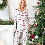 Woman standing next to a christmas tree with her hip popped smiling wearing long sleeve pajama set in holiday tree farm
::: Model is 5'10" wearing size S Tall ///
---PJ 4